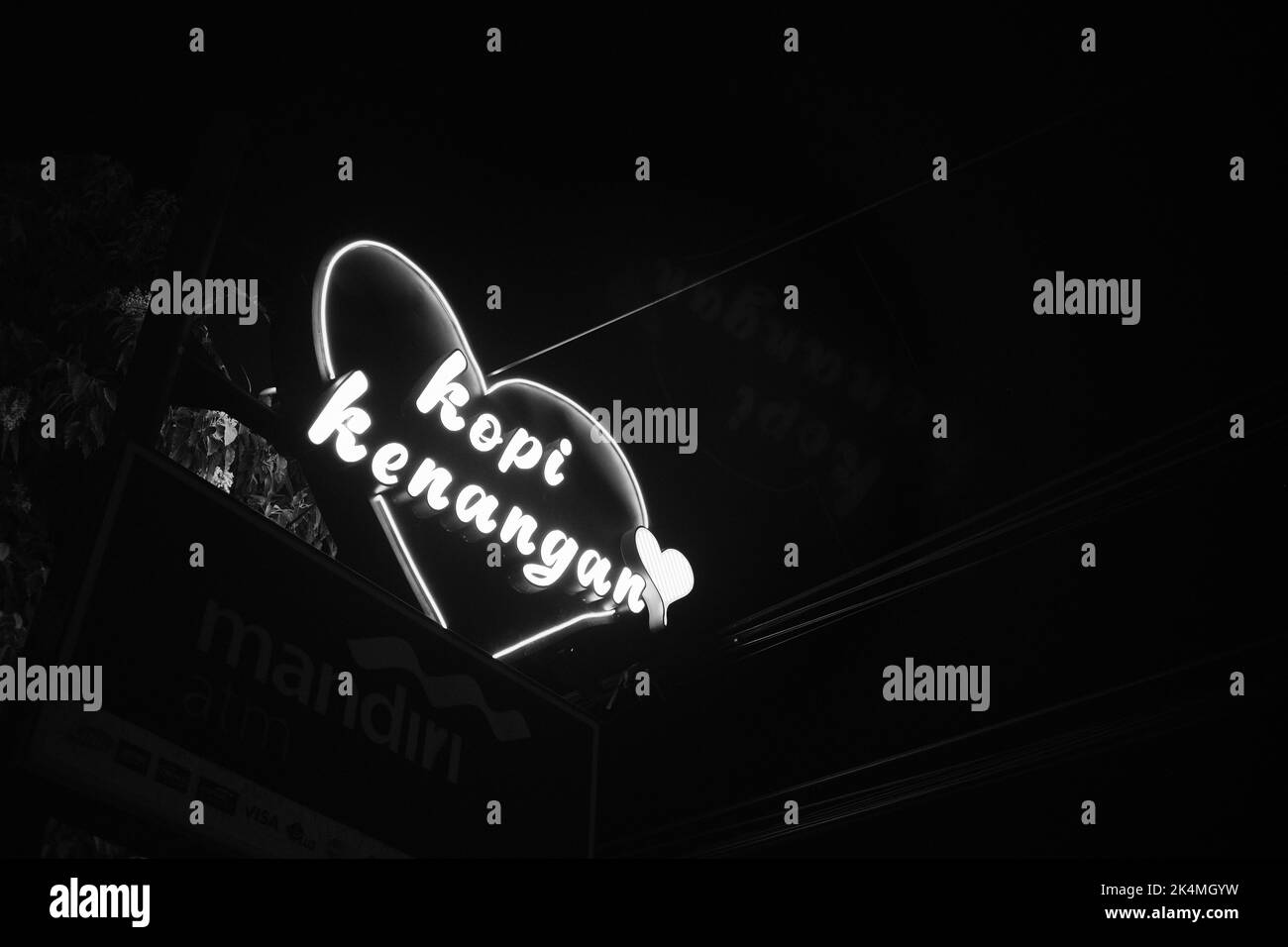 Cicalengka, West Java, Indonesia - 27 September, 2022 : Monochrome photo of neon lights from the drink brand sign 'Kopi Kenangan' Stock Photo