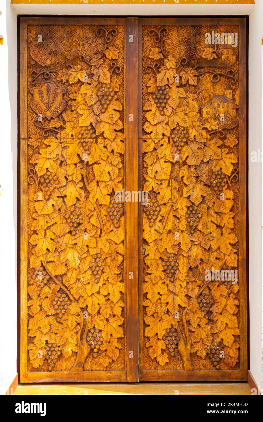 wood carving of grape leaves and grapes Stock Photo Alamy