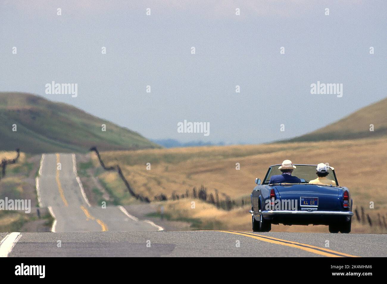 Classic cars driving on some bye ways of California USA Stock Photo