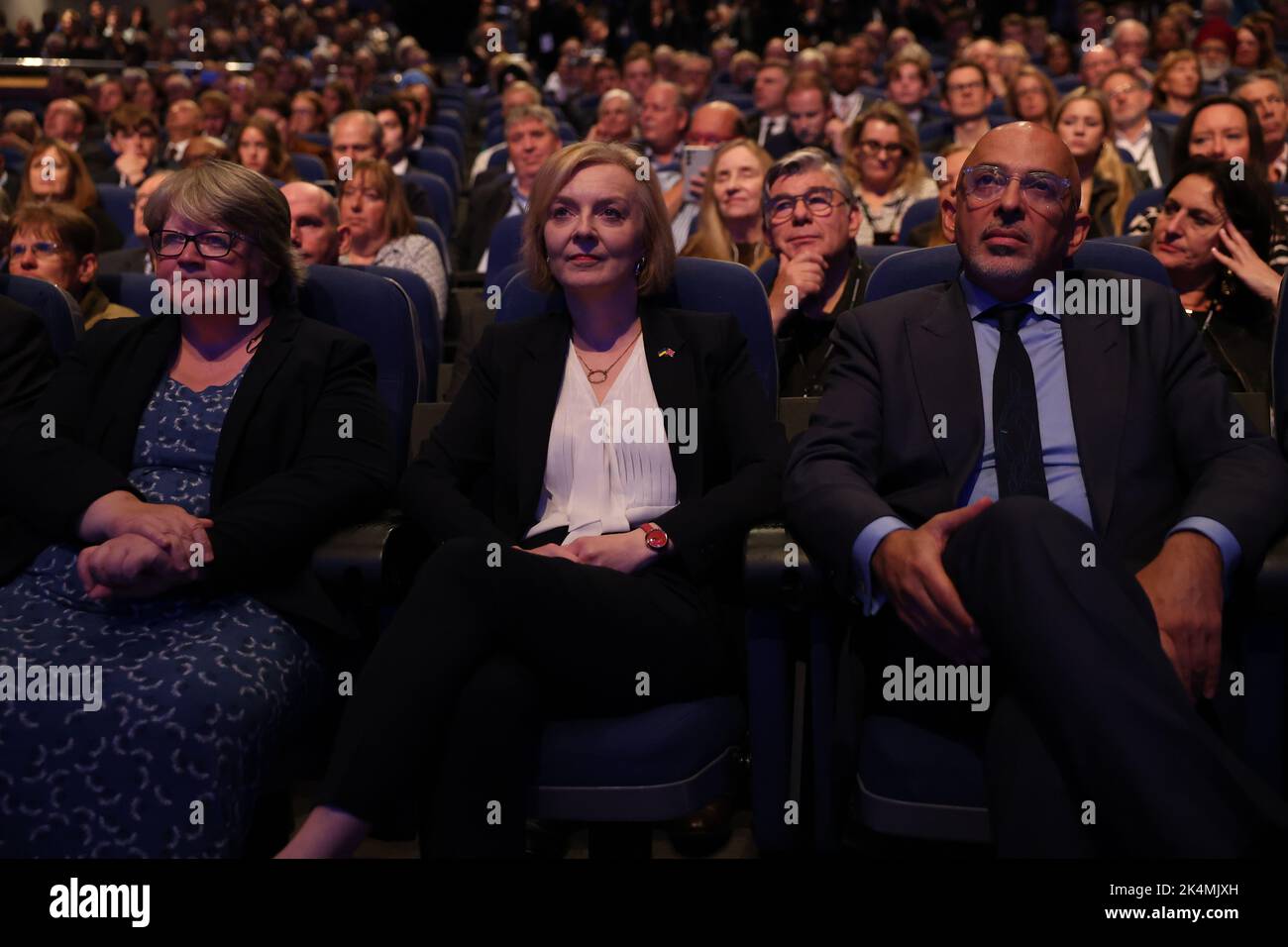 London, UK. 3 October, 2022. (L-R) Britain's Health Secretary Therese Coffey, British Prime Minister Liz Truss and Chancellor of the Duchy of Lancaster, Nadhim Zahawi, lwatch the Chancellor of the Exchequer Kwasi Kwarteng while delivering his speech during the Conservative Party's annual conference at the International Convention Centre in Birmingham. Picture date: Monday October 3, 2022. Credit: Isabel Infantes/Empics/Alamy Live News Stock Photo