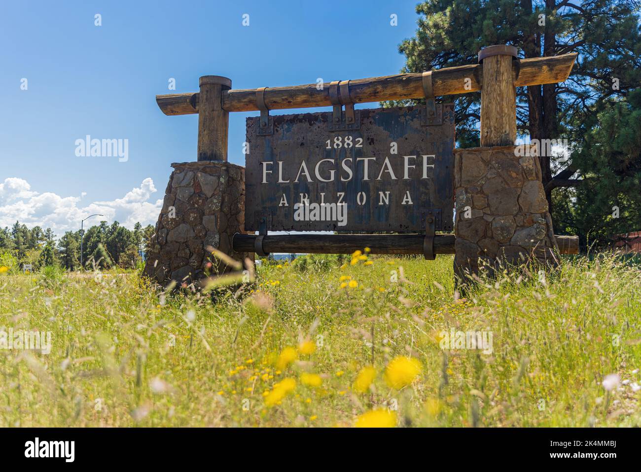 Rustic sign at the town limits of Flagstaff, Arizona Stock Photo