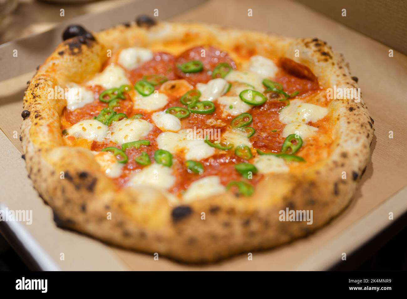 Jjust now cooked pizza from oven inside a pizza box ready for delivery