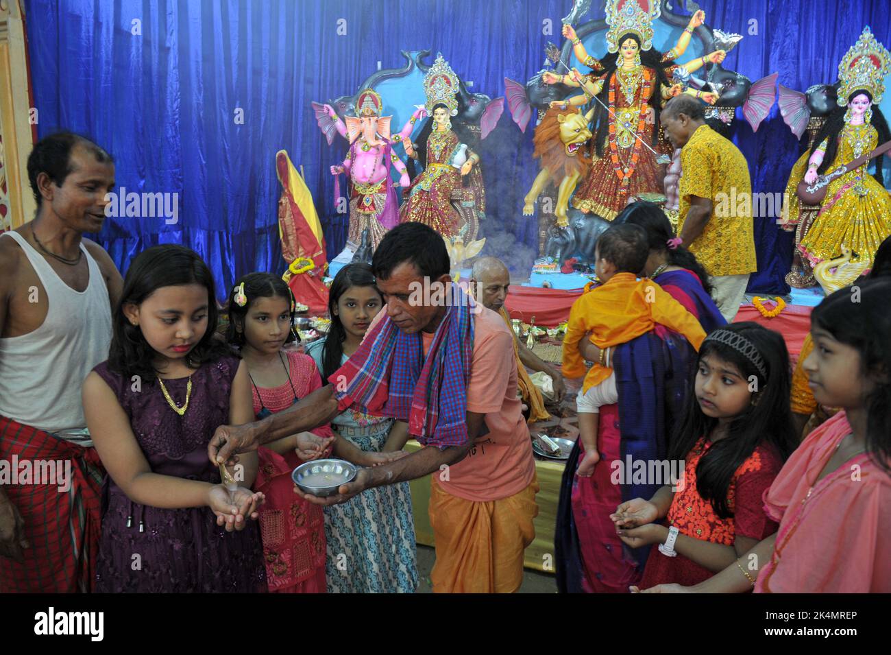 Sylhet, Bangladesh. 1st Oct, 2022. On Mahasaptami day of Durga Puja, Anjali is being offered to the devotees in Machudighi Para. on October 1, 2022 in Sylhet, Bangladesh. (Credit Image: © Md Rafayat Haque Khan Eyepix G/eyepix via ZUMA Press Wire) Stock Photo
