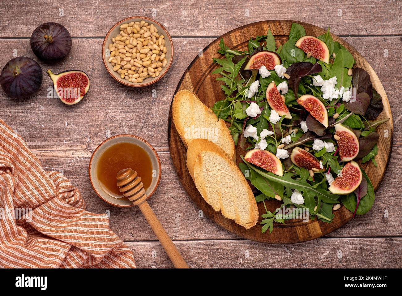 Food photography of salad with goat cheese, figs, leaves, pine nuts