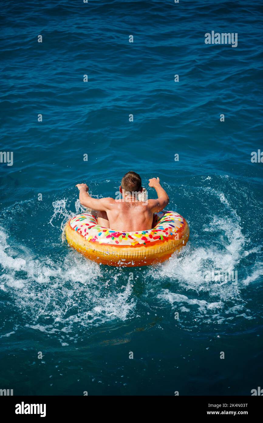 Fat man float pool hires stock photography and images Alamy