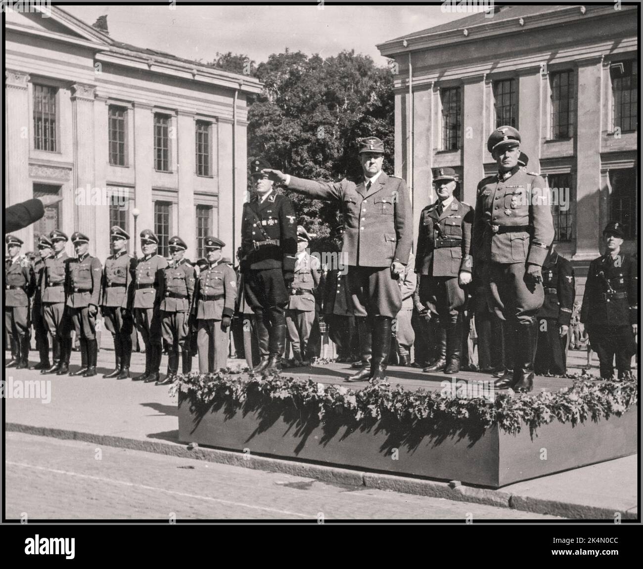 NORWEGIAN QUISLINGS The SS Day' (Norwegian: SS-dagen) in Oslo, Norway 14-15 August 1943, an event celebrating the Norwegian volunteers in Germanic SS Norway' (Germanske-SS Norge, GSSN) with parades, sport competitions, speeches, etc. Showing Vidkun Quisling and other leaders of his National Union (Nasjonal Samling, NS) as well as Wilhelm Rediess and other Nazi German leaders outside Oslo University in Nazi occupied Norway during Second World War. WW2 The paramilitary GSSN was at the same time a Norwegian branch of Germanic-SS, and a sub organization of the Norwegian Nazi party National Union. Stock Photo