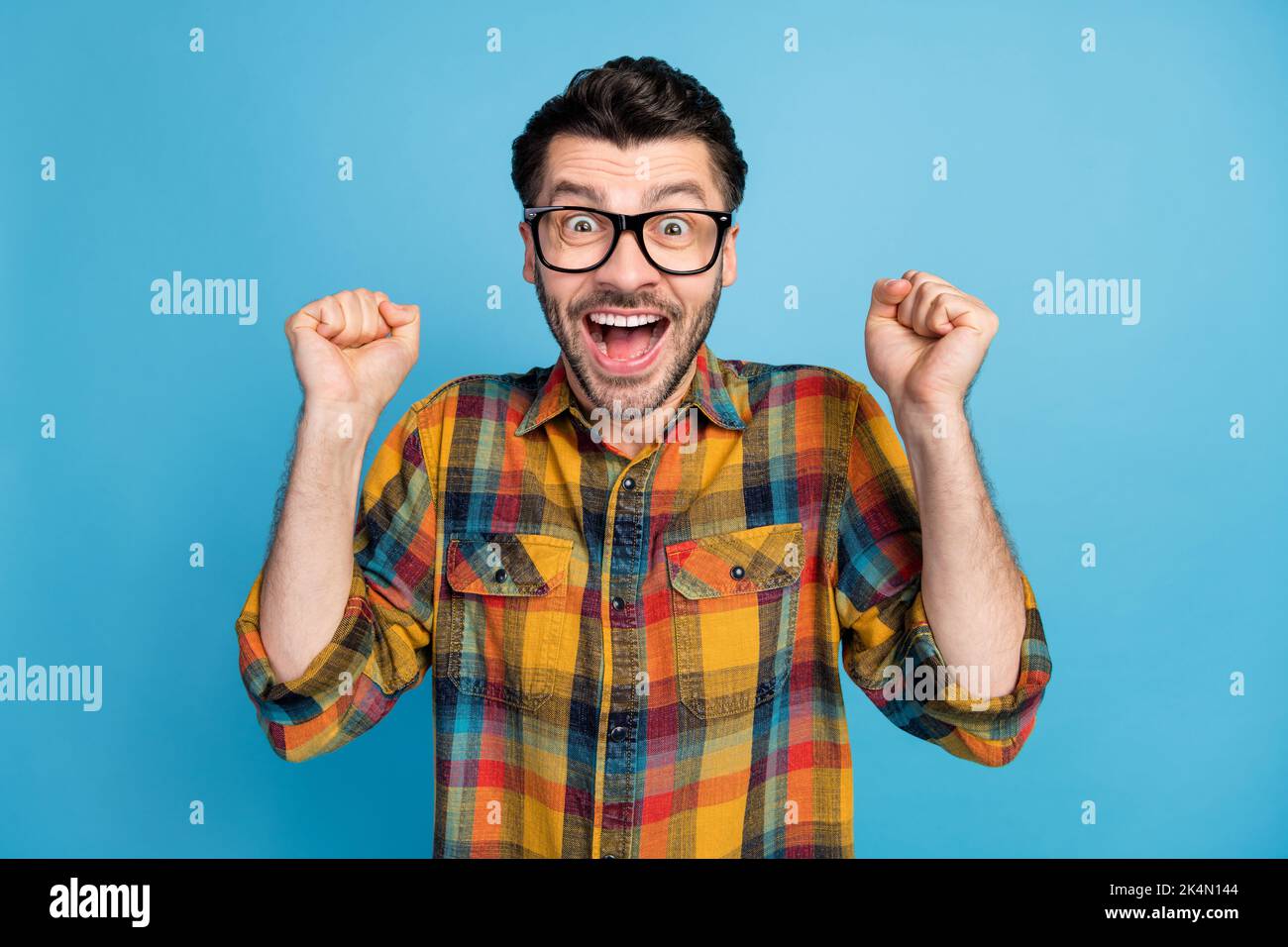 Photo of impressed astonished ecstatic man wear glasses plaid shirt ...