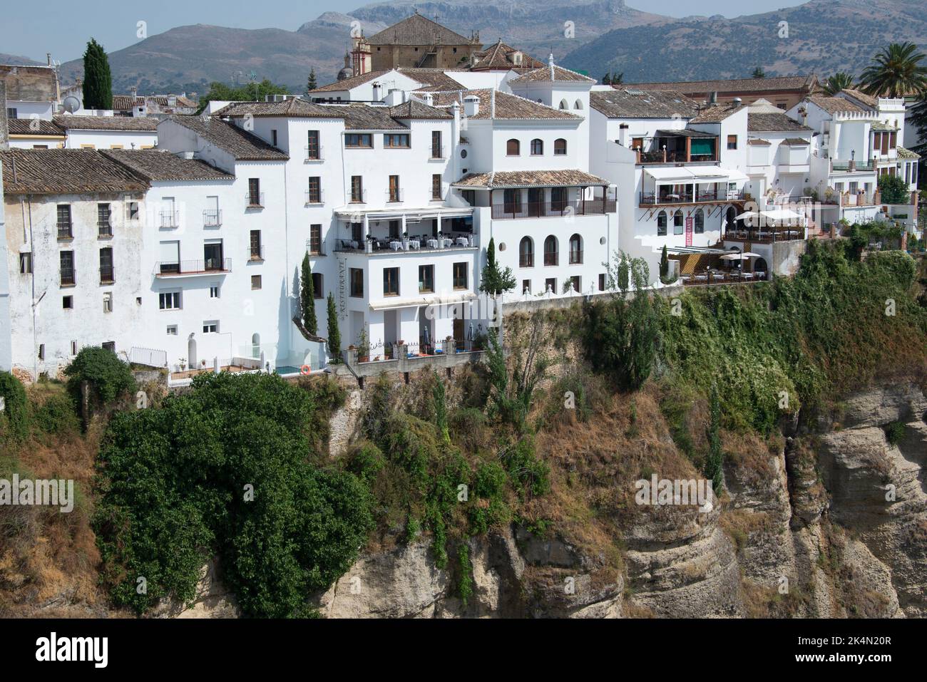 Ronda, houses on cliff (tajo). Serranía de Ronda, Málaga, Andalusia, Spain. Stock Photo