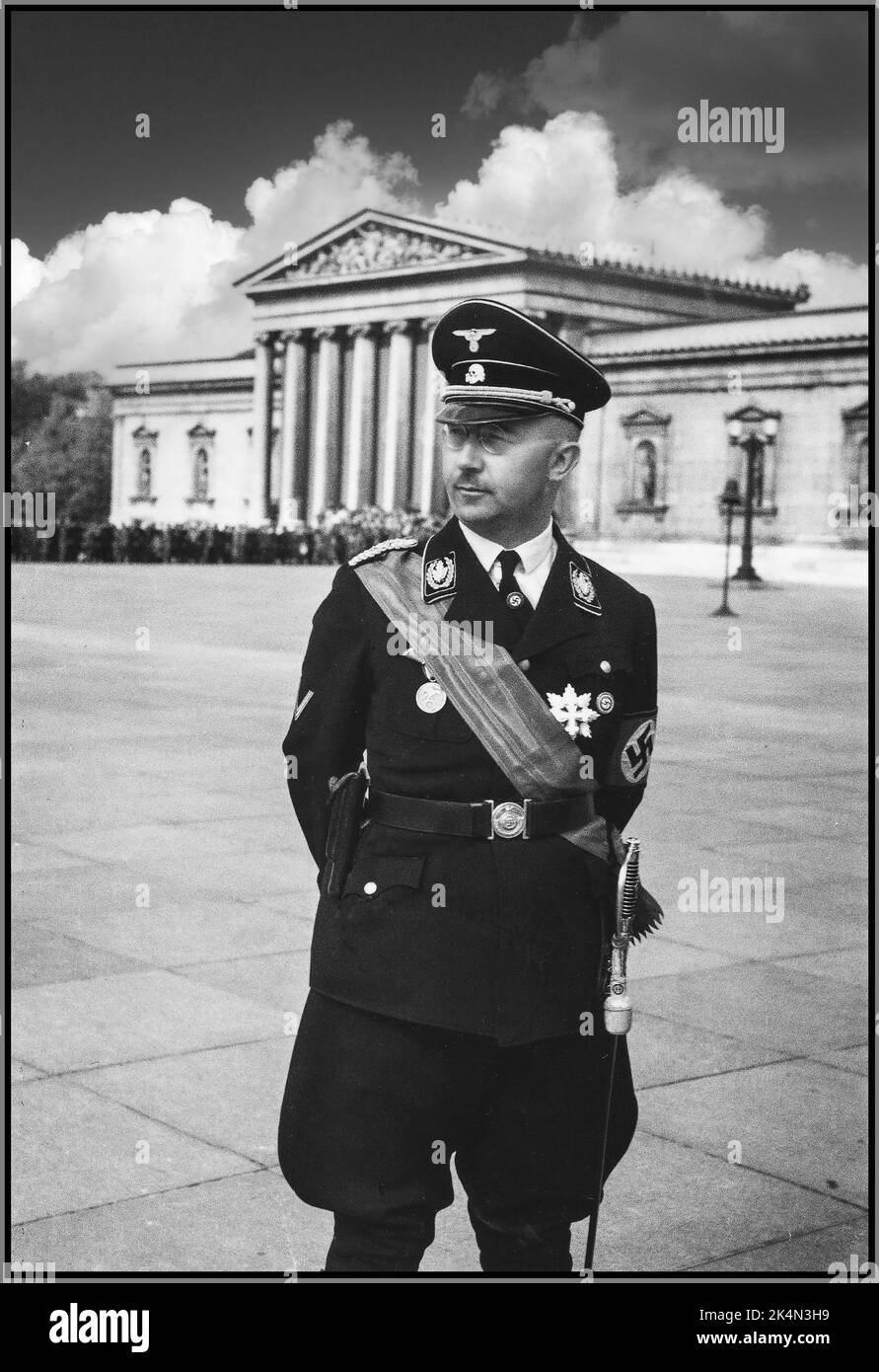 Heinrich Himmler in his full ceremonial Nazi Waffen SS uniform at the occasion of a meeting between Adolf Hitler and Benito Mussolini in Munich Nazi Germany 1930s Heinrich Luitpold Himmler was Reichsführer of the Schutzstaffel, and a leading member of the Nazi Party of Germany.  Himmler was one of the most powerful men in Nazi Germany and a main architect of the Holocaust. Himmler a war criminal guilty of crimes against humanity commited suicide in 1945 to escape his inevitable execution by hanging. Stock Photo