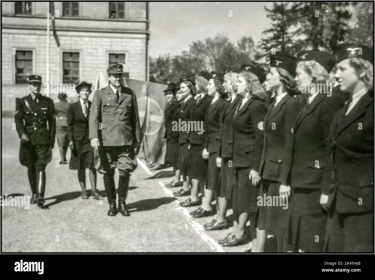 QUISLINGS NORWAY Vidkun Quisling inspects NS women in uniform  at Slottsplasse Oslo Norway18 May 1943: 'The roll call at Castle Square yesterday. The Prime Minister thanks his comrades in arms for 10 years of effort. Norwegian National Socialists (Quislings) in collaboration with Nazi Party of Germany WW2 Stock Photo