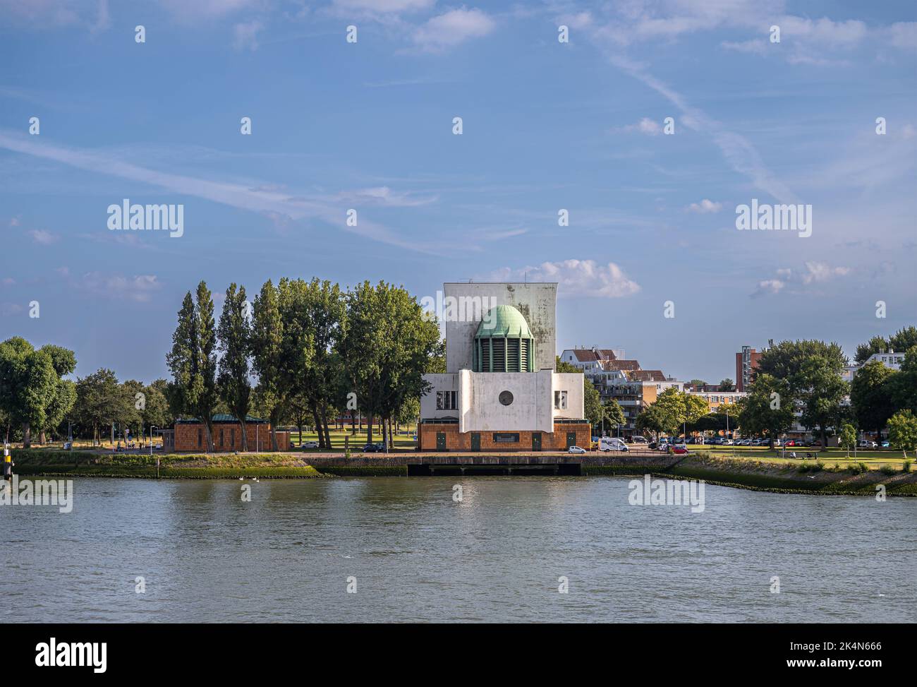Rotterdam, Netherlands - July 11, 2022: Maastunnel, passage, air ventilation builidng in green setting on shoreline of New Meuse River under which car Stock Photo
