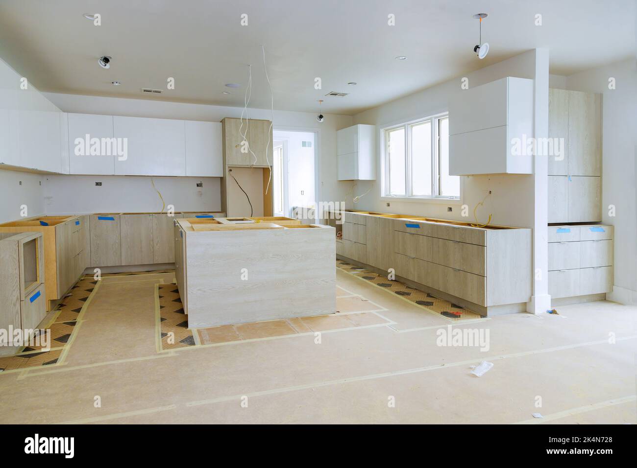 In a newly constructed house, white kitchen were installed in