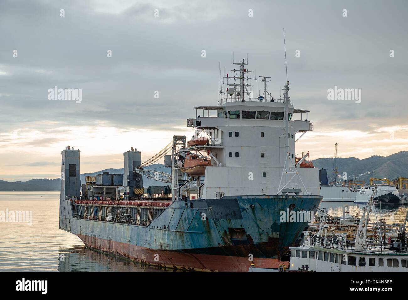Ship vessel water docked industrial transportation port freight sea cargo vessel harbor Stock Photo