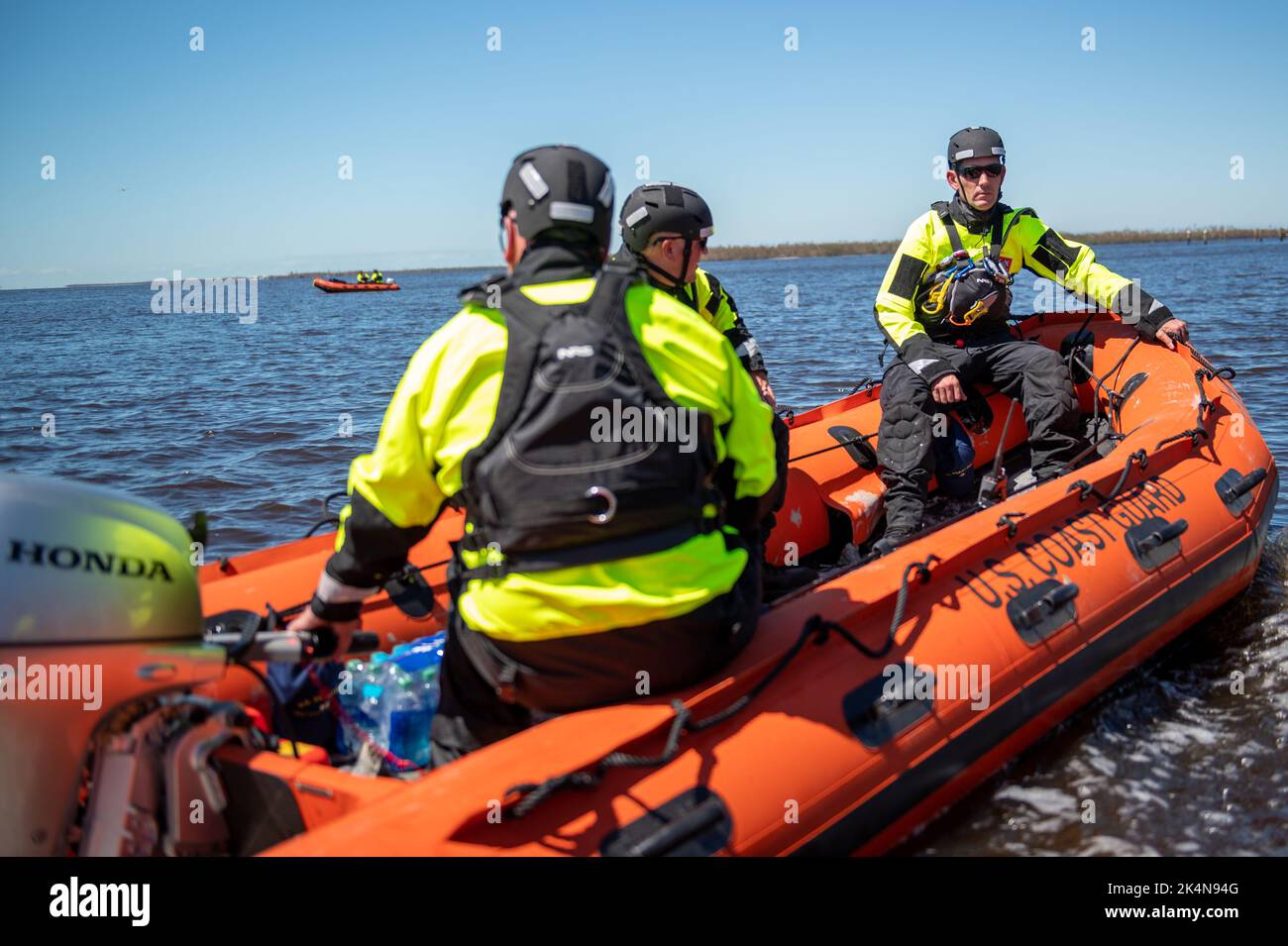 Coast Guard personnel from the Gulf, Atlantic, and Pacific Strike teams during search and rescue operations to assist stranded people on Sept. 30, 2022 near Sanibel Island, Florida. Sanibel Island community members were stranded after Hurricane Ian made landfall in the area. Stock Photo
