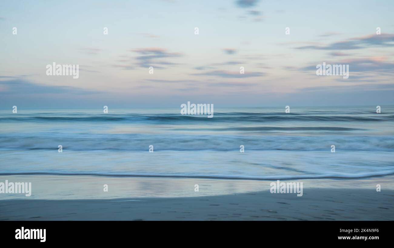 Slow shutter-speed photograph of  sunset from Amelia Island, Florida. Stock Photo