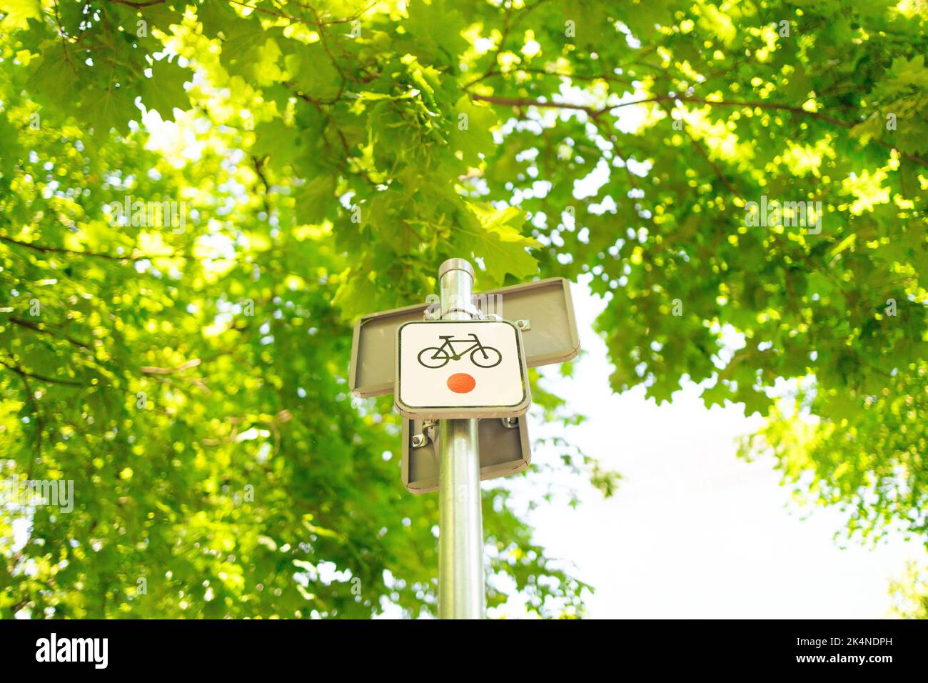 bike path sign in city park. Alerting pedestrians about the movement of ...