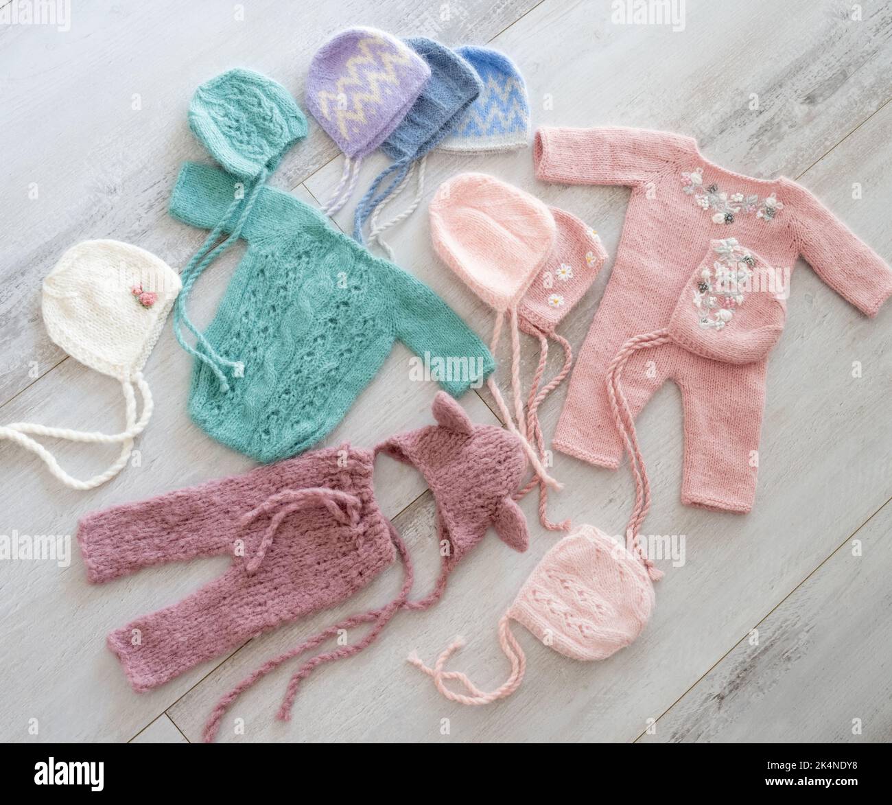Simple knitted handmade clothes for newborn babies Stock Photo Alamy