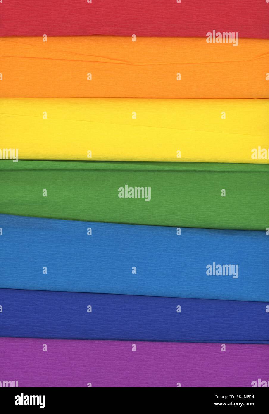 Colorful crepe rolls abstract background. 7 rolls of crepe paper