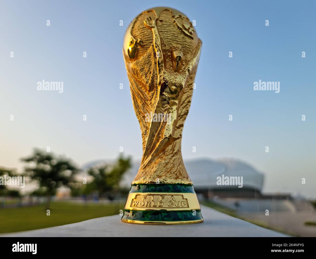 Trophy of the FIFA World Cup against the background of the Al Janoub stadium in Qatar. Stock Photo