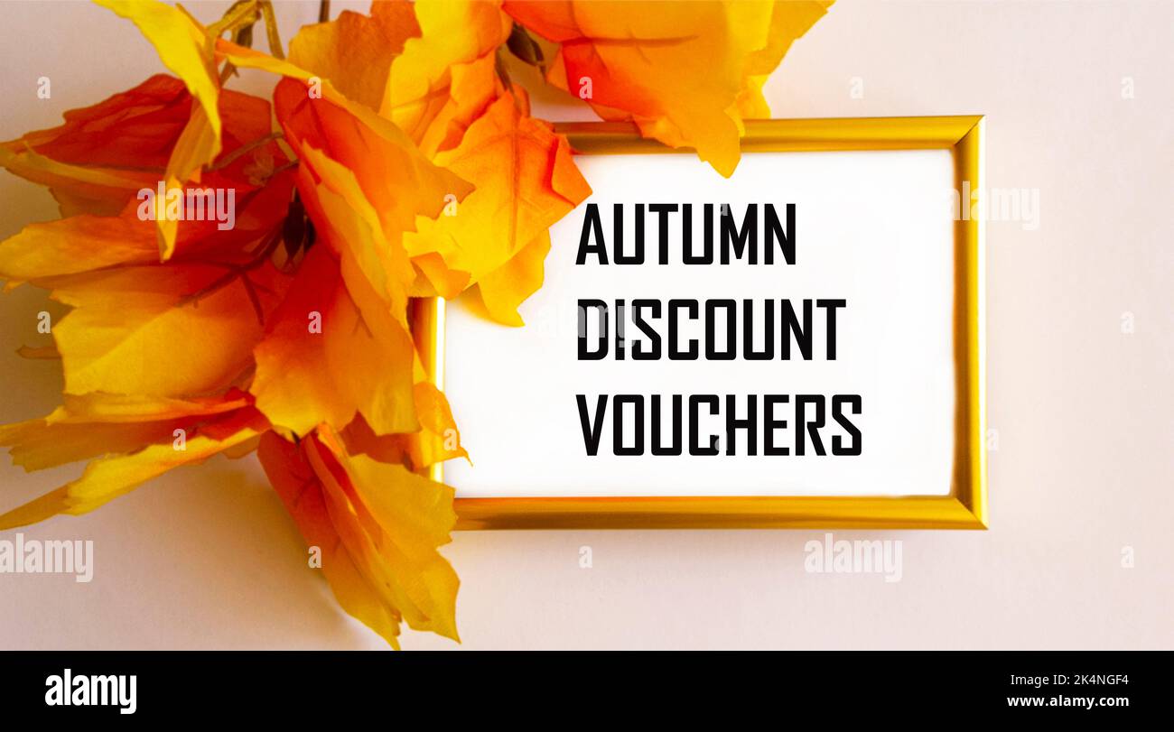 autumn disckount vouchers on a frame framed by yellow foliage Stock Photo