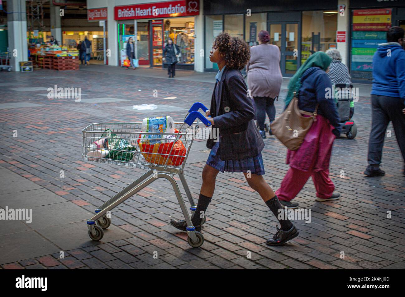London, UK. Sept 29 2022 . Girl waring school uniform walks with