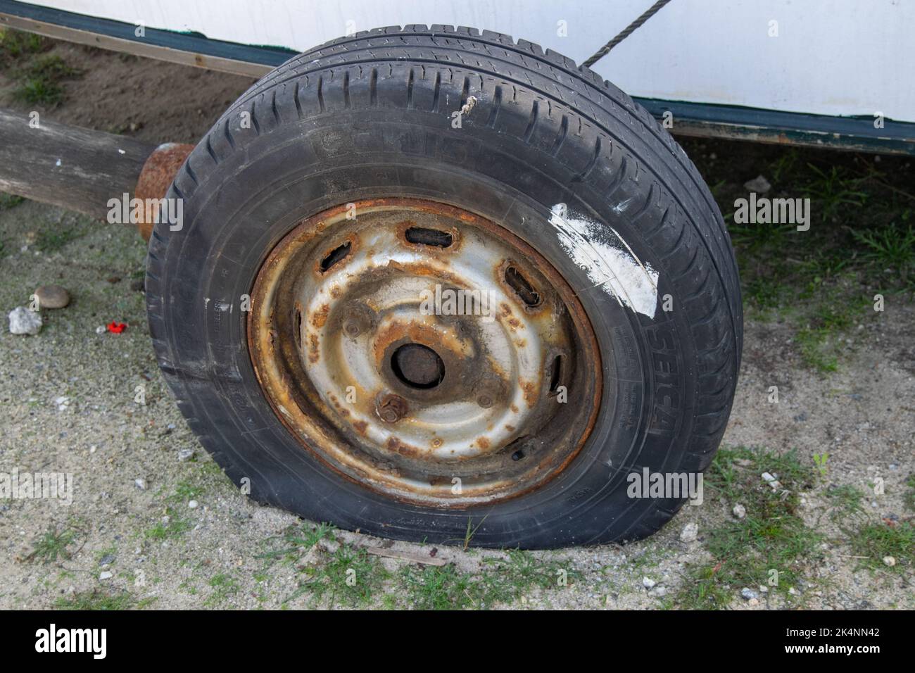 Flat tire, insurance or incidents. Traveling hazards. Stock Photo
