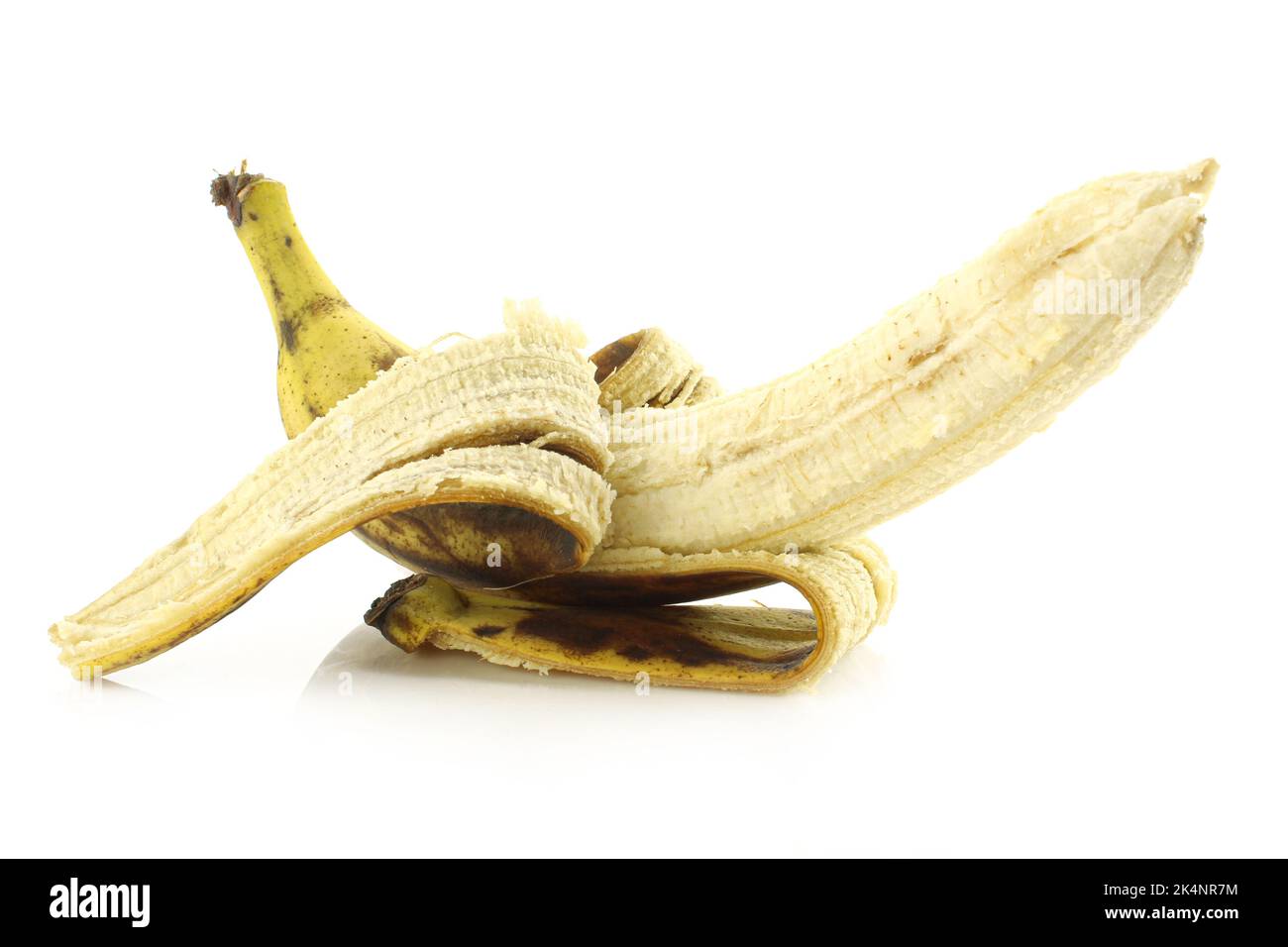 Half peeled overripe banana isolated on white background Stock Photo