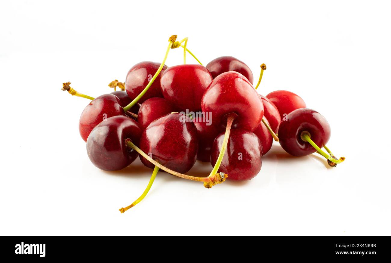 Group of bright cherries with stem isolated on white background Stock