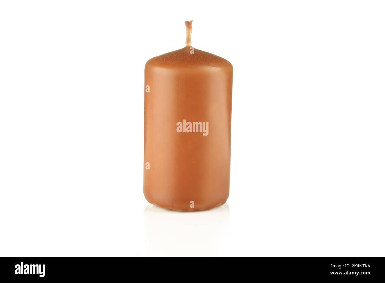 Brown candle isolated on white background. Single candlestick Stock