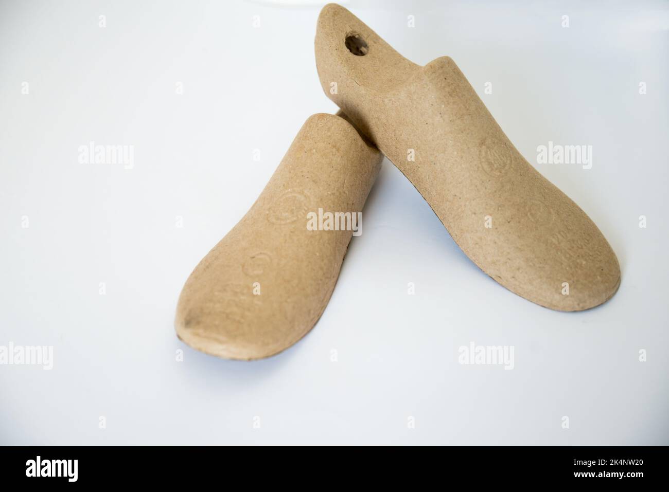 Two cardboard shoe lasts with white background. Right and left foot Stock Photo