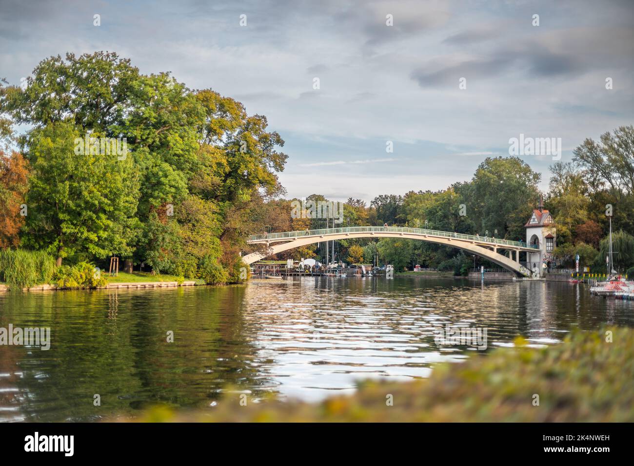 Abteibrücke (Abbey bridge) over the river Spree leading to the Island of Youth (Insel der Jugend) during autumn, Berlin Treptow, Germany, Europe Stock Photo