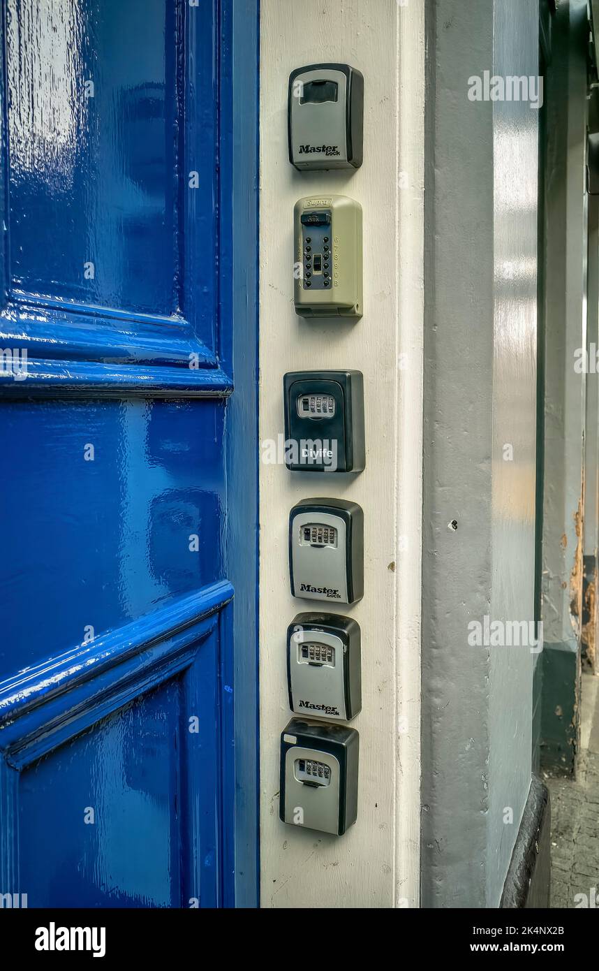 Airbnb key boxes on a tenement door, Edinburgh, Scotland, UK Stock