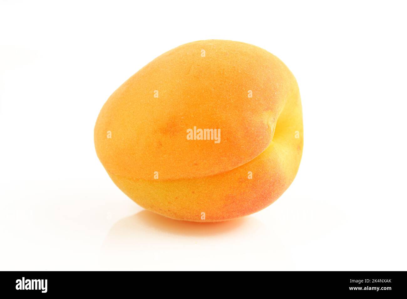 One whole apricot fruit isolated on white background Stock Photo Alamy