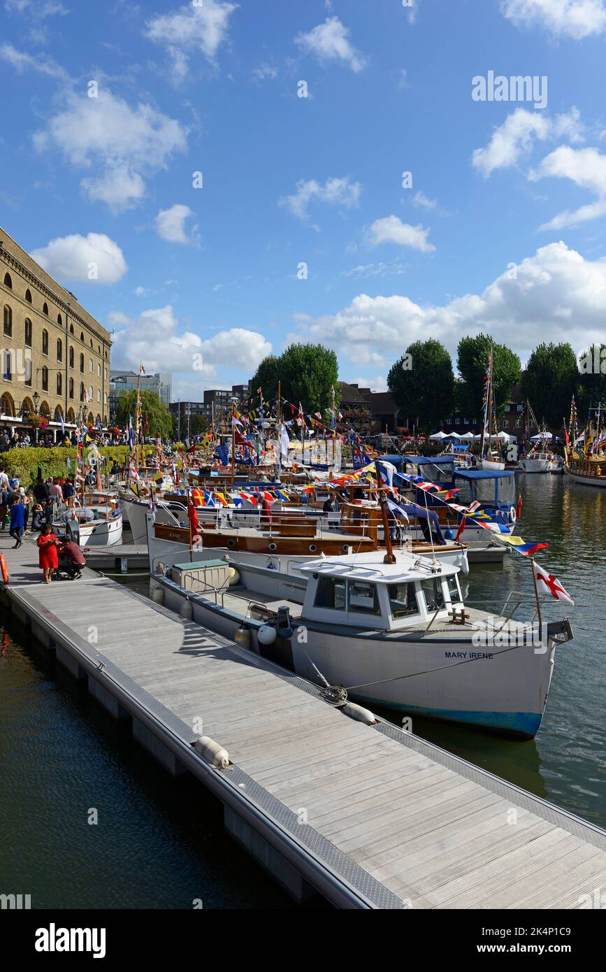 Many restored and well-loved wooden yachts are docked in St Katharine's dock for the Classic Boat Festival. London, UK. Stock Photo