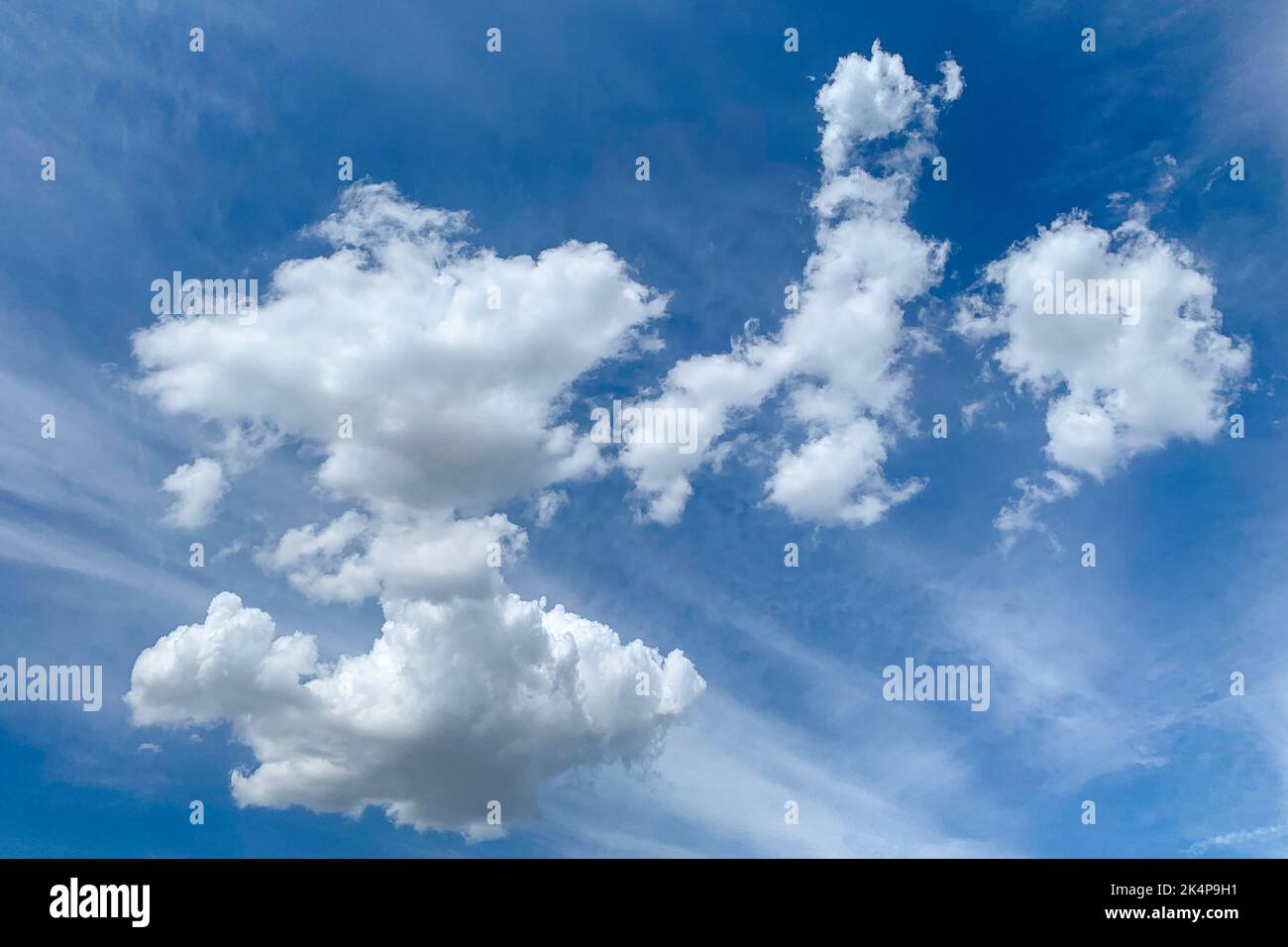 White clouds in blue sky. Beautiful fluffy clouds on blue heaven background Stock Photo