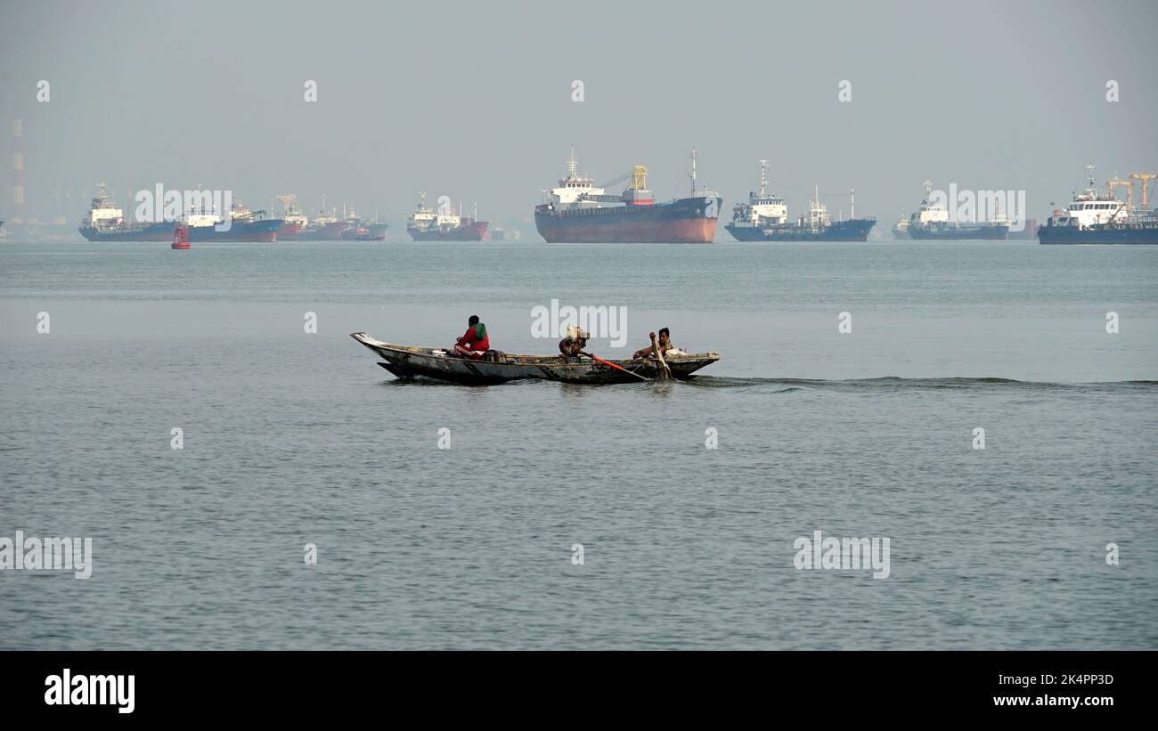 Traditional boat maneuver in Tanjung Perak port, Surabaya, Indonesia on August 2022 Stock Photo