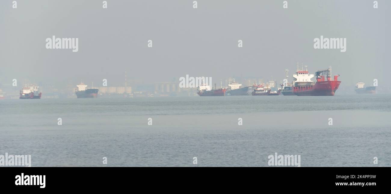 Commercial ships anchored at Tanjung Perak port area, Surabaya, Indonesia Stock Photo
