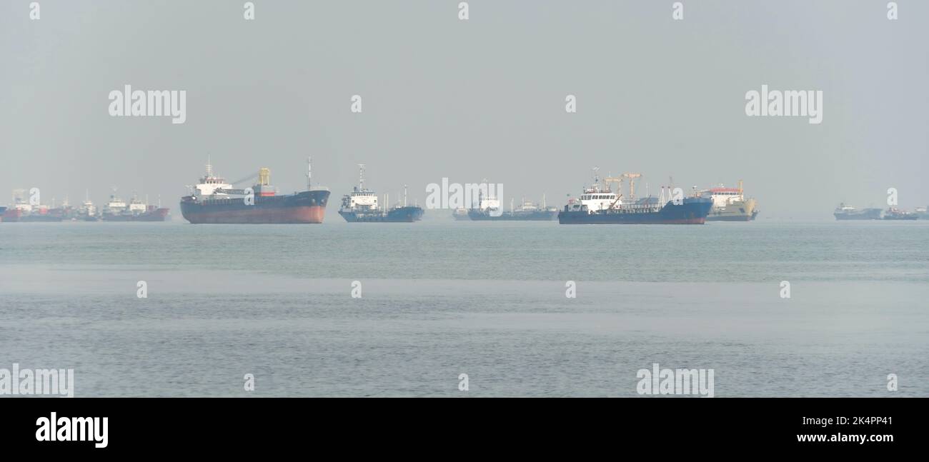 Commercial ships anchored at Tanjung Perak port area, Surabaya, Indonesia Stock Photo