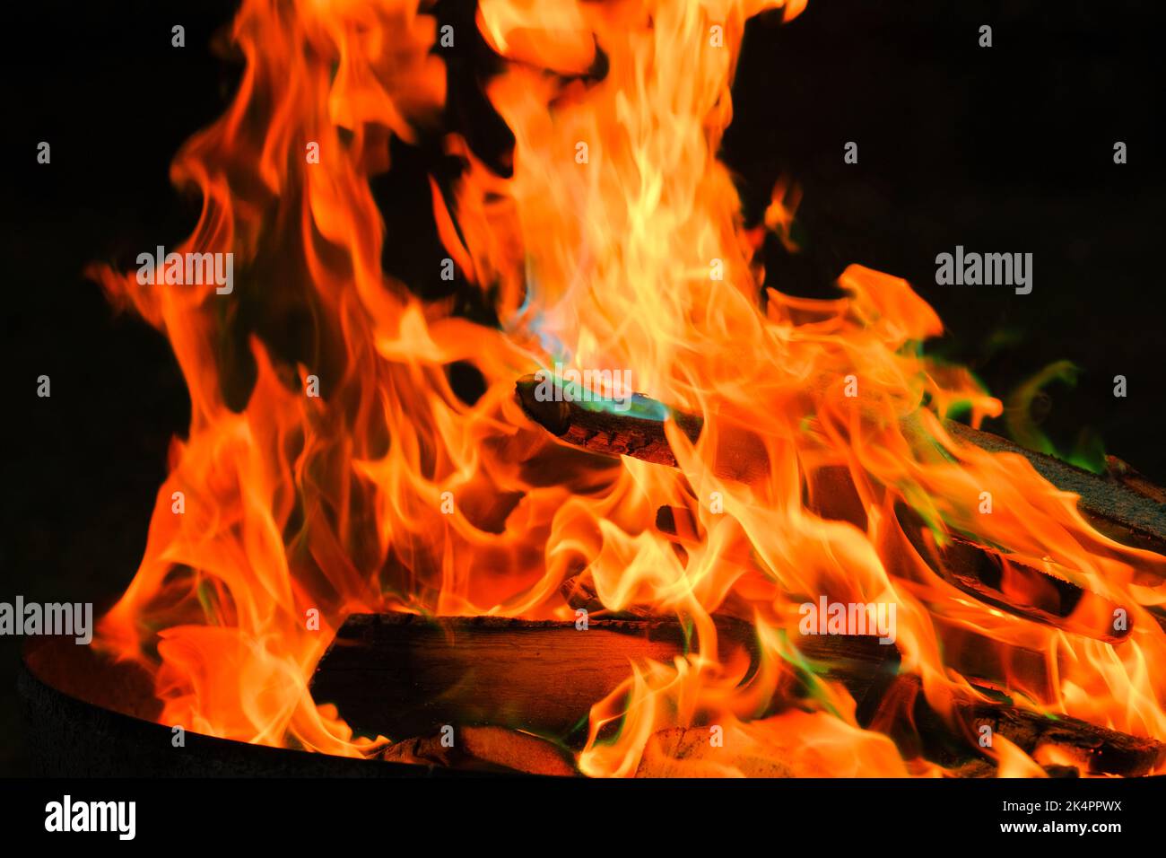 Flame.Firewood burning in bonfire. Flames on a black background ...
