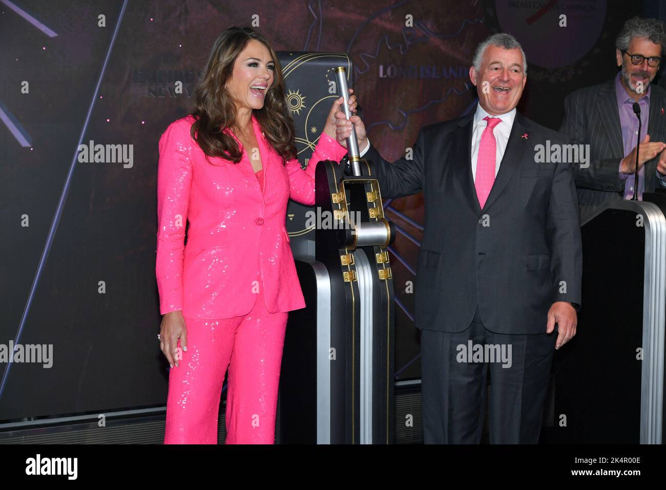 Elizabeth Hurley and Executive Chairman of Estée Lauder William P. Lauder visit the Empire State Building on October 03, 2022 in New York City. Stock Photo