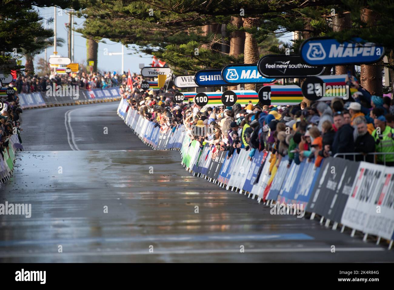 Thousands of fans line the finishing straight for the finish of the Elite Women's road race