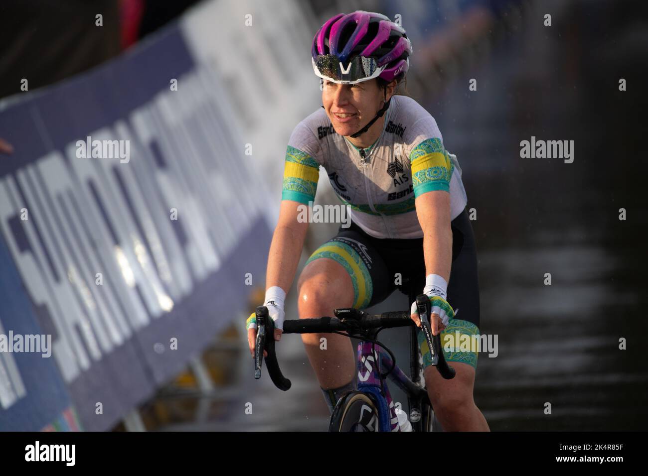 Amanda Spratt of Australia crosses the finish line at the end of the women's elite road race, 2022 UCI Road Cycling World Championships. Stock Photo