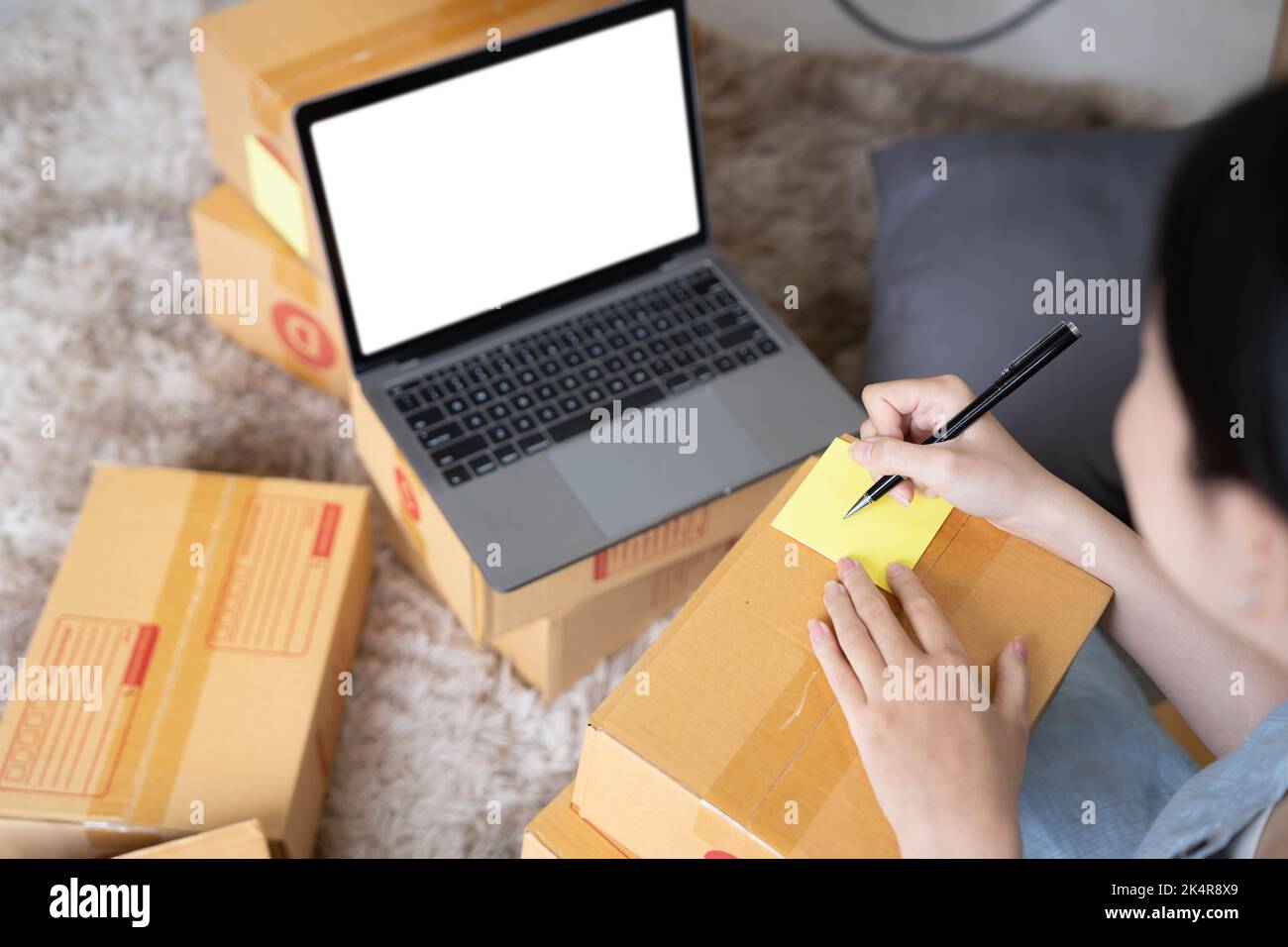 Top above view of her she girl sale manager freelancer sitting on carpet packing order thing accessory distribution industry self-employed writing Stock Photo