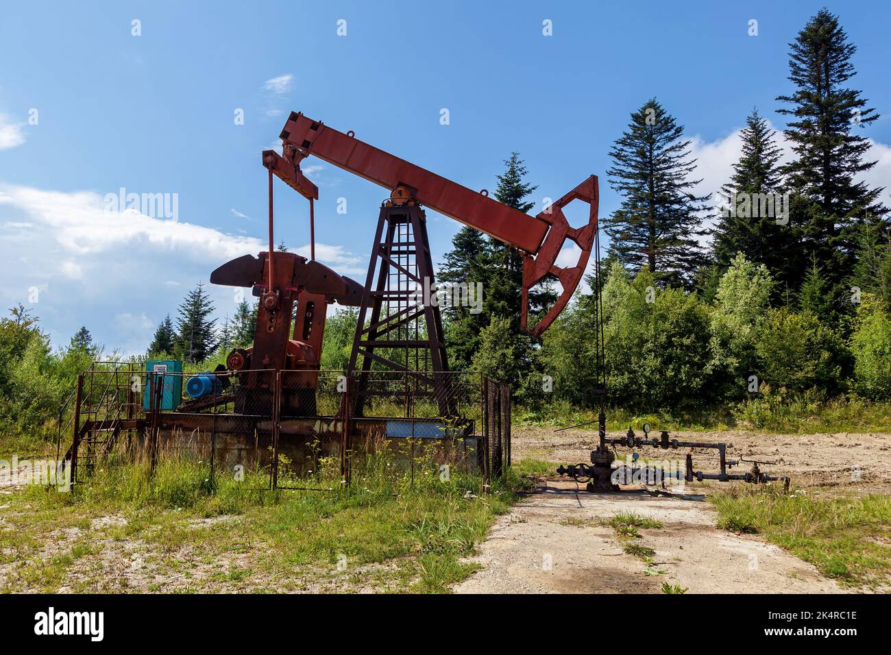 An oil rig pumps oil from underground to the surface Stock Photo - Alamy
