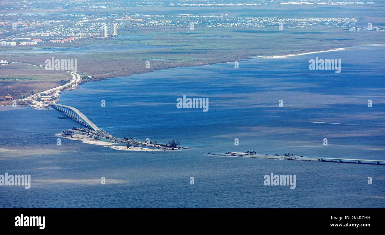 Aerial view on September 29, 2022, of Sanibel Island and a section of the Sanibel Causeway (the only road linking Florida's Sanibel Island to the Gulf Coast mainland) washed out from the devastating onslaught of Hurricane Ian the previous day. Stock Photo