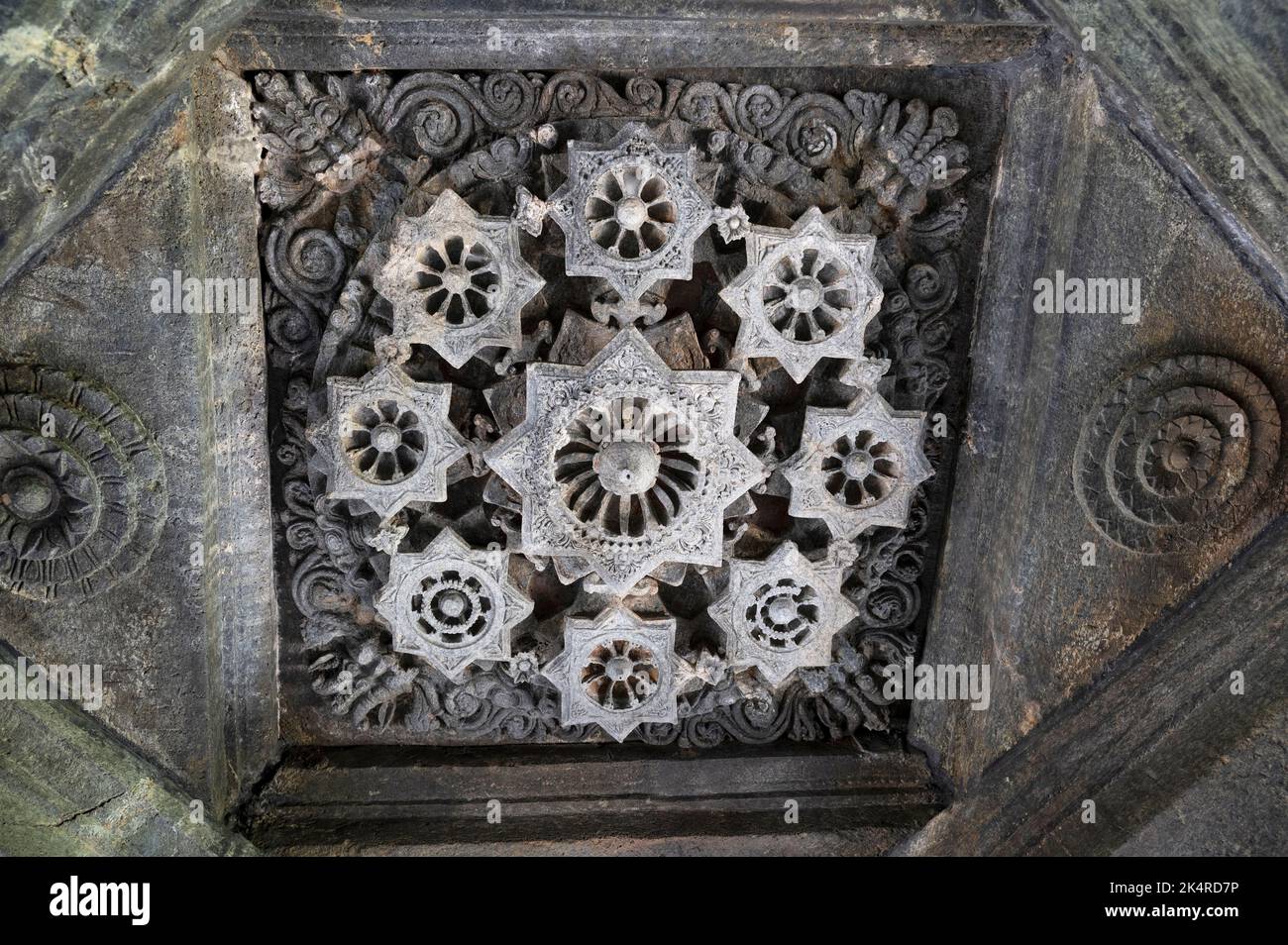 Carved ceiling of the Mahadeva Temple, (Tambdi Surla) a 12th-century Shaivite temple built in the Kadamba style from basalt. Near Bhagwan Mahaveer Wil Stock Photo
