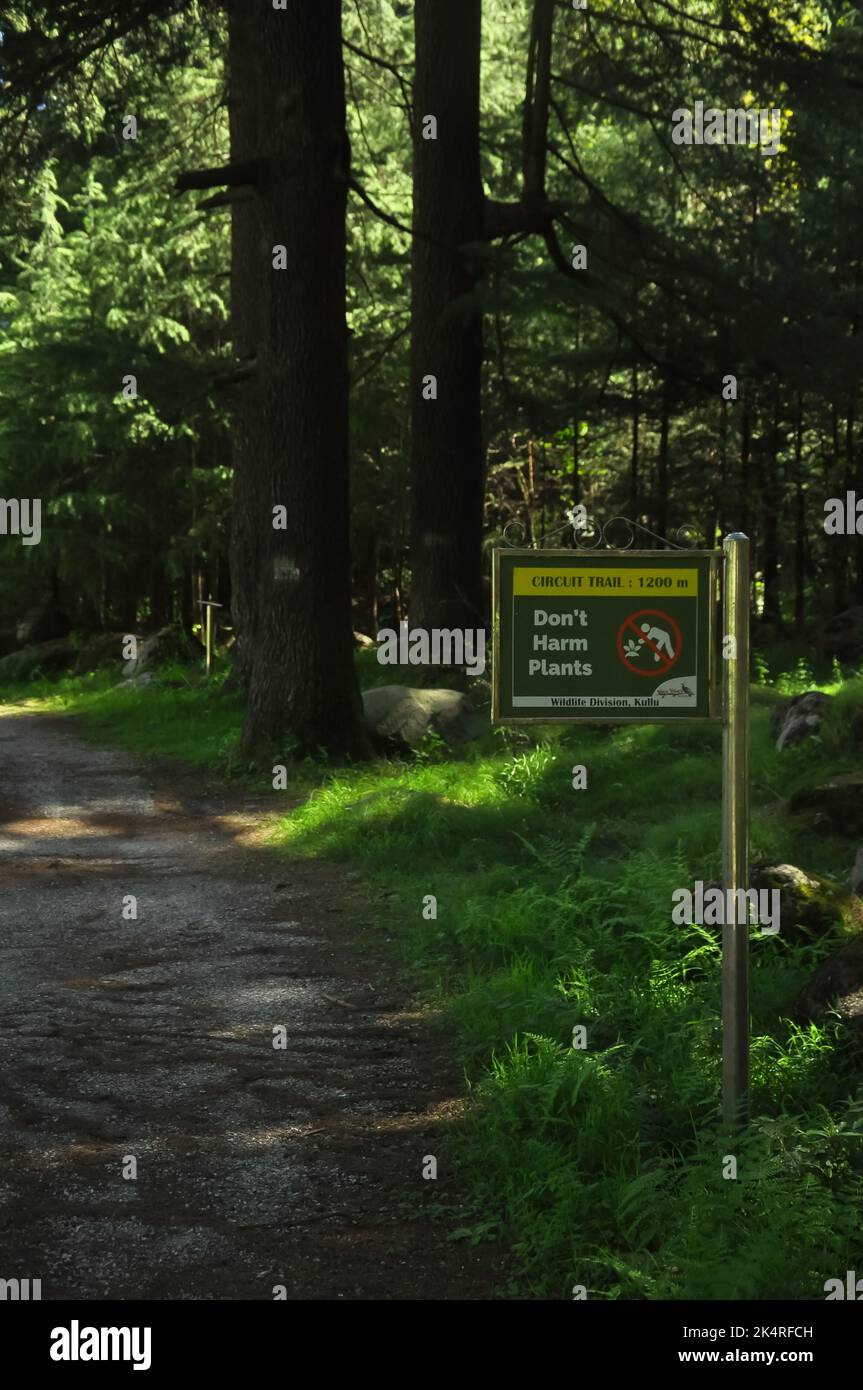 Don't Harm Plants sign board in Van Vihar National Park in Manali, Himachal Pradesh, India Stock Photo