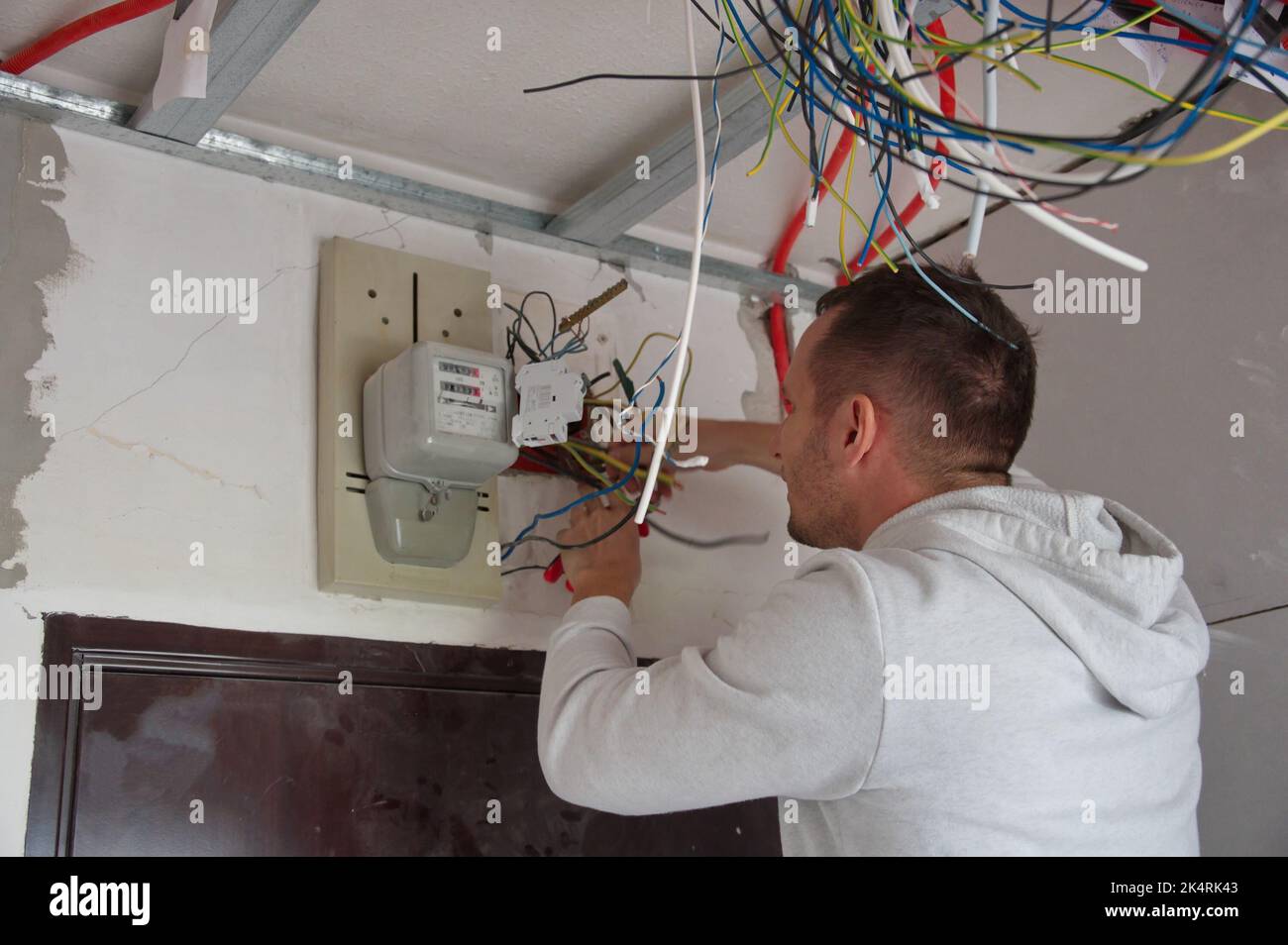 Electrician technician at work on electric installation Stock Photo Alamy