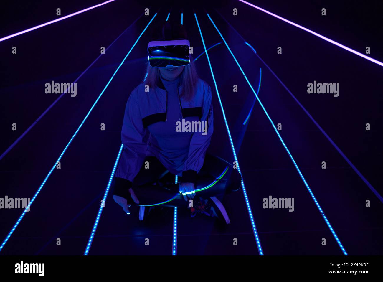 Woman is using virtual reality headset to access in metaverse. Concept ...