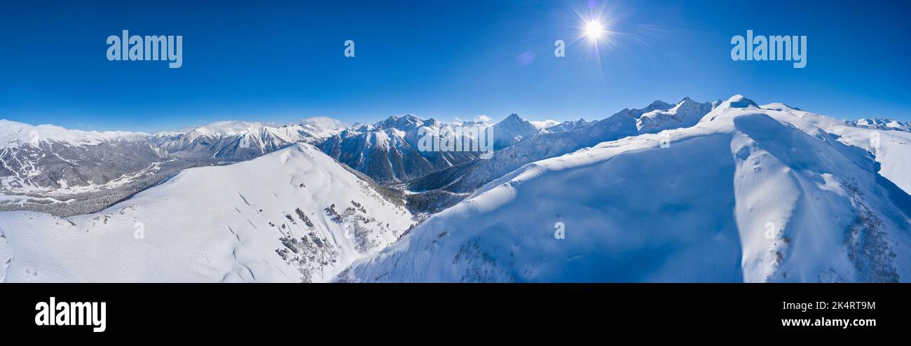 Panorama of winter landscape with snowy mountains. Stock Photo